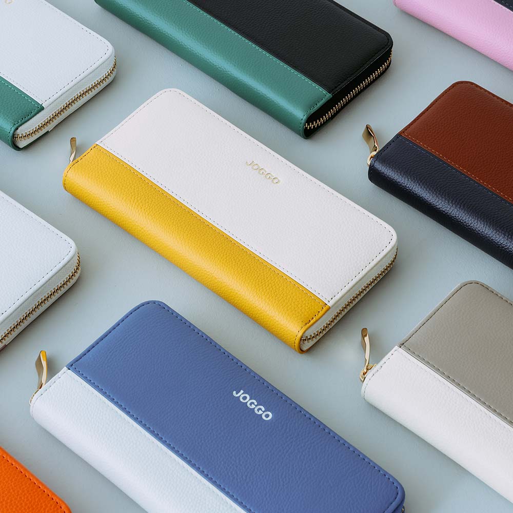 シンプルラウンドバイカラー長財布（エンボス） - 高級感のあるゴールドの引き手がレザーの質感を引き立てます。バッグから取り出したときの印象も上品です。完全に閉まるラウンドファスナーのため、中身を落とす心配もありません。