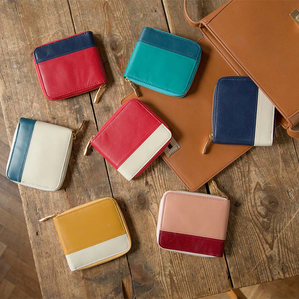 ラウンド２つ折り財布（バイカラー） - バイカラーがオシャレな品格のあるデザイン。高級本革を用いて一つひとつハンドメイドで製作した特別な本革製品は、メンズ・レディースを問わずギフトに最適です。