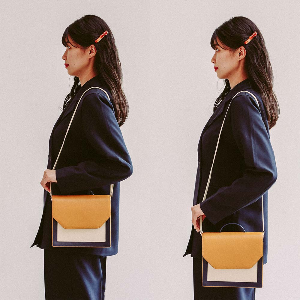 ２ｗａｙエンベロープミニバッグ - ショルダーストラップは、身長や好みに合わせて60〜100cmまで調整できます。斜めがけにすることも可能です。