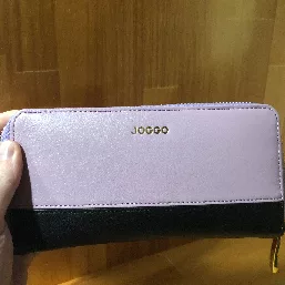 Gold letters with purple and black leather